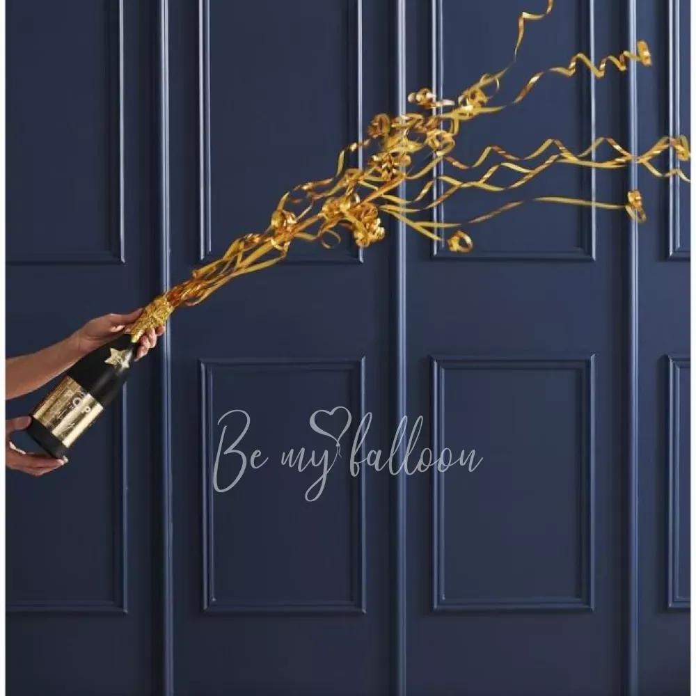 زجاجة الشمبانيا مع القصاصات الملونة